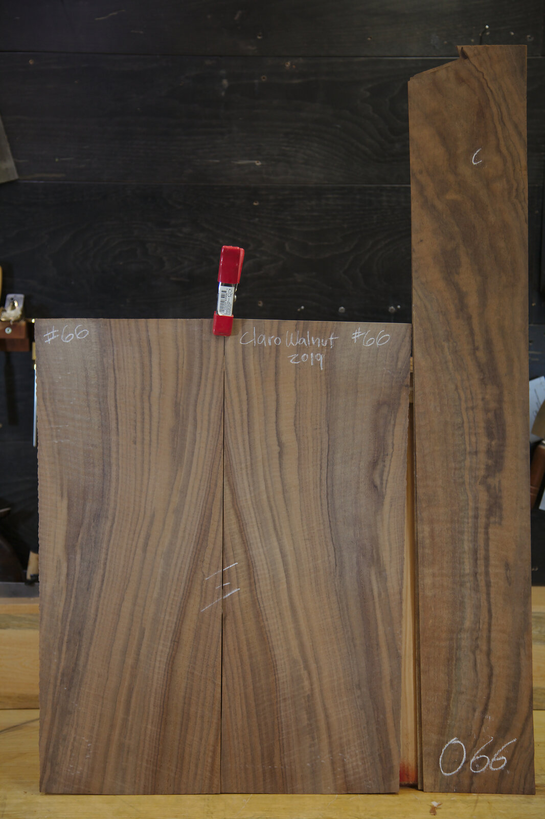 The Claro walnut set for the back and sides, chalk-marked #66, in Ryan&rsquo;s workshop
