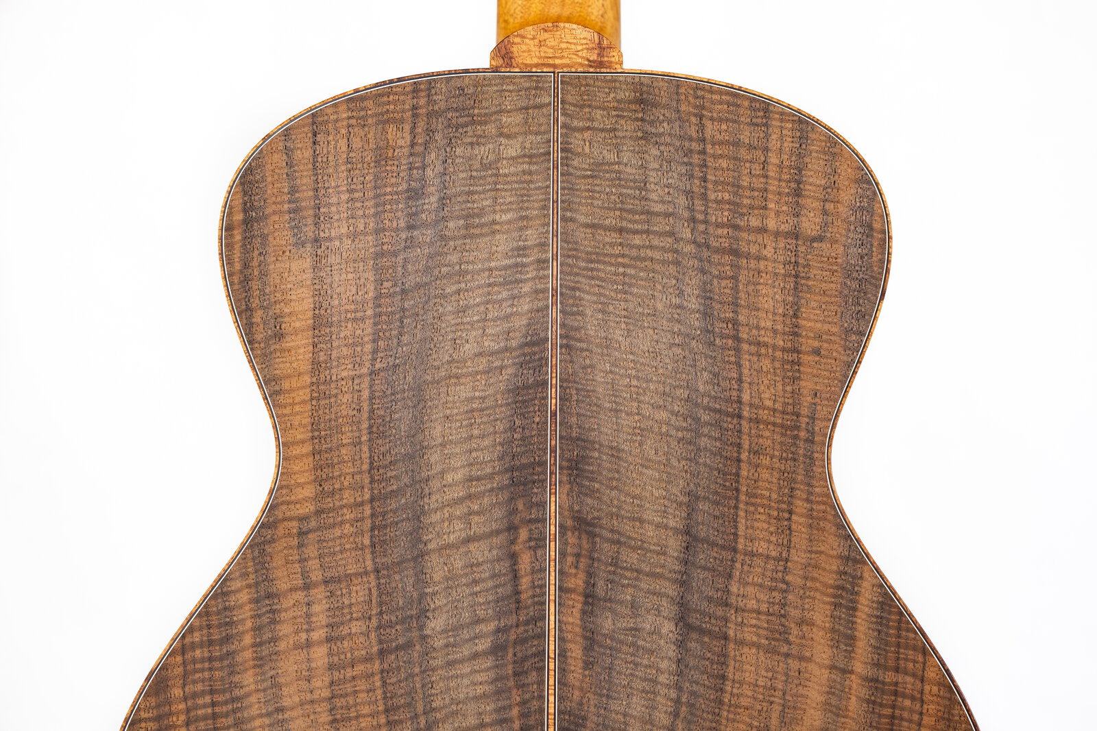 The finished back of the guitar in bookmatched Claro walnut