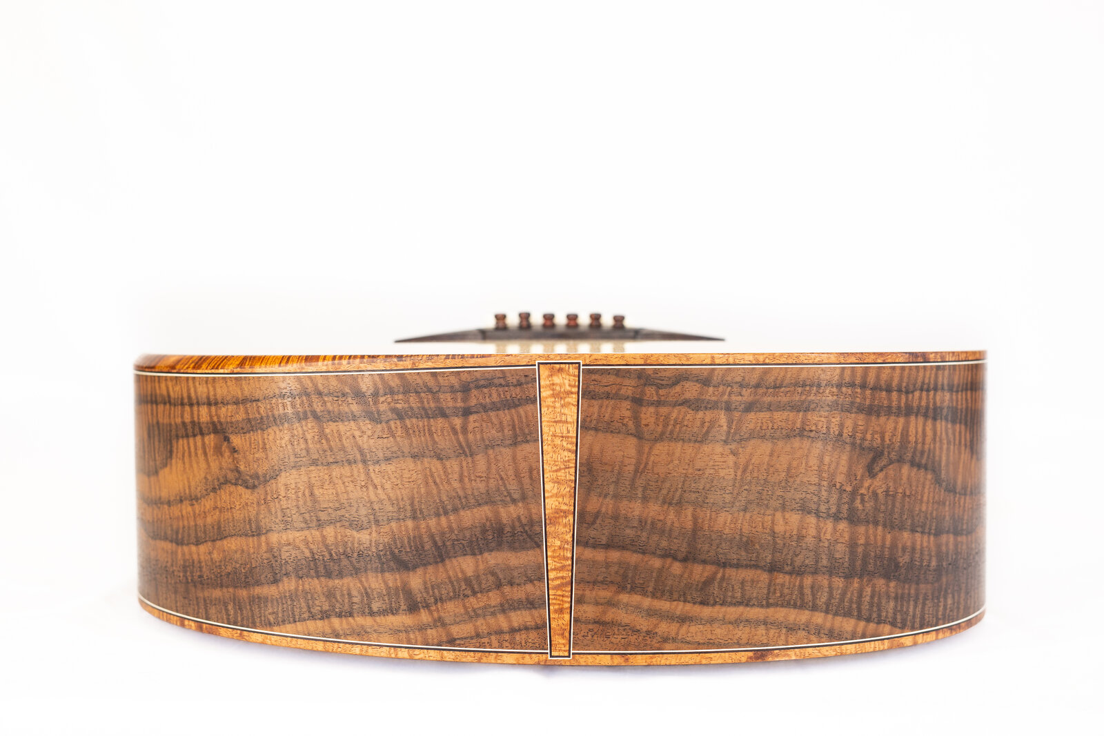 The guitar seen from the tail end, showing the subtle wedge shape of the body