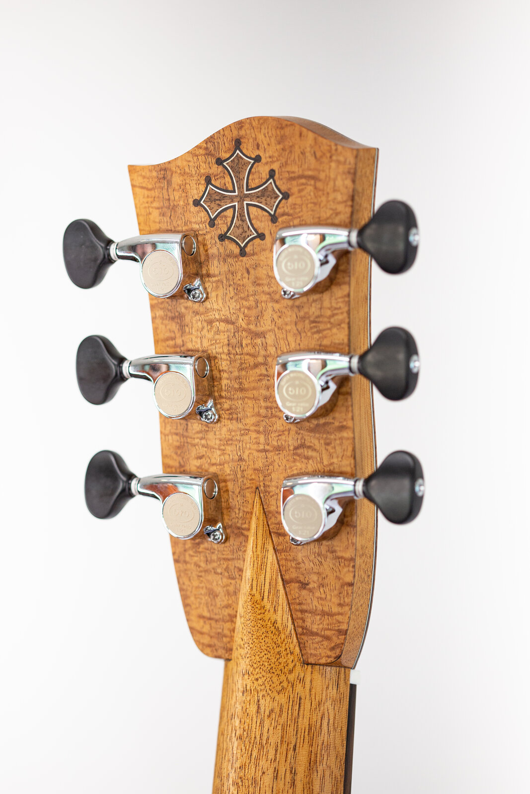 The back of the headstock with the inlaid Occitan cross
