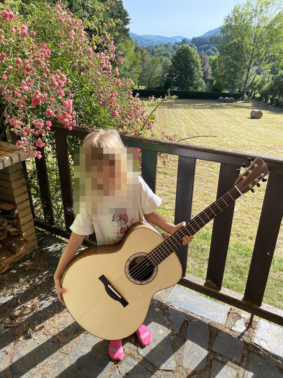 Matilda holding her guitar